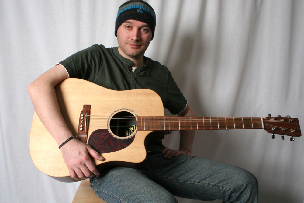 John Moxey Relaxed, With Acoustic Guitar